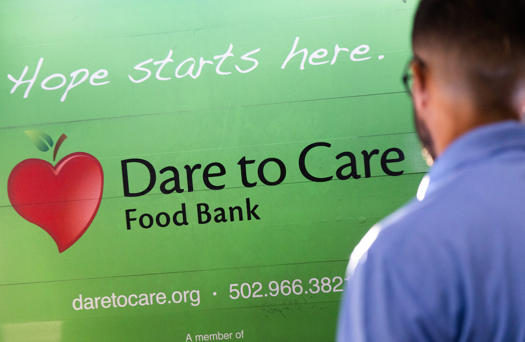 Dare to care banner showing the logo and the website address along with phone number 502 966 3821